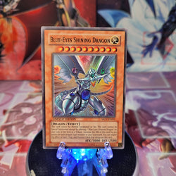 A Super Rare "Blue-Eyes Shining Dragon" card from the Yugioh Set: The Movie Promo Set (MOV).