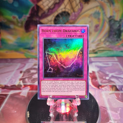 A 1st edition Ultra Rare "Born from Draconis" card from the Yugioh Set: Battles of Legend: Relentless Revenge.