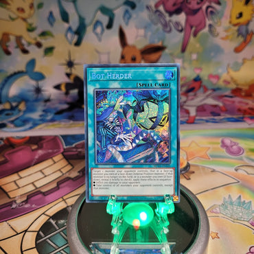 A Prismatic Secret Rare "Bot Herder" card from the Yugioh 2025 Mega-Tin Mega Pack (MP25).