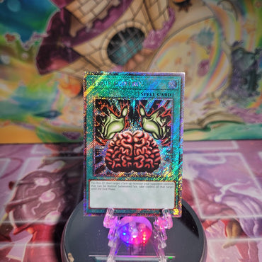 A Platinum Secret Rare "Brain Control" card from the Yugioh Set: Quarter Century Bonanza (RA03).