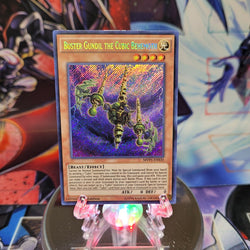 A Secret Rare "Buster Gundil the Cubic Behemoth" card from the Yugioh Set: The Dark Side of Dimensions Movie Pack: Secret Edition.