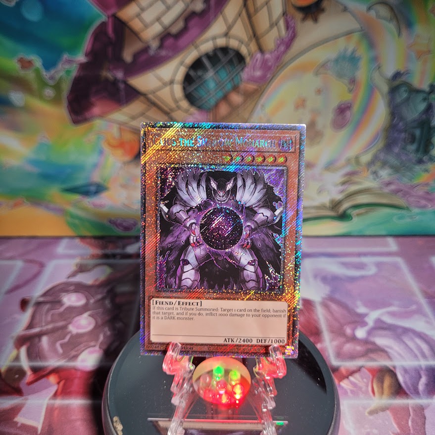 A Platinum Secret Rare "Caius the Shadow Monarch" card from the Yugioh Set: Quarter Century Bonanza (RA03).