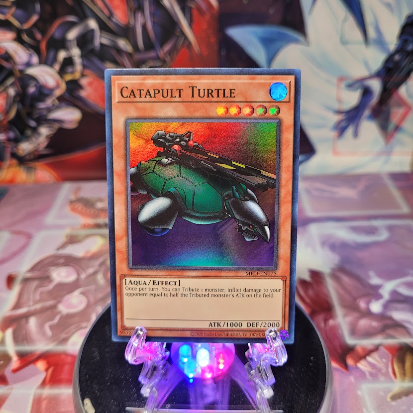 A Super Rare "Catapult Turtle" card from the Yugioh Set: Metal Raiders (MRD).