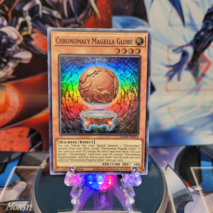 A Super Rare "Chronomaly Magella Globe" card from the Yugioh Set: Number Hunters.