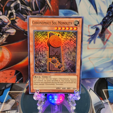 A Super Rare "Chronomaly Sol Monolith" card from the Yugioh Set: Number Hunters.