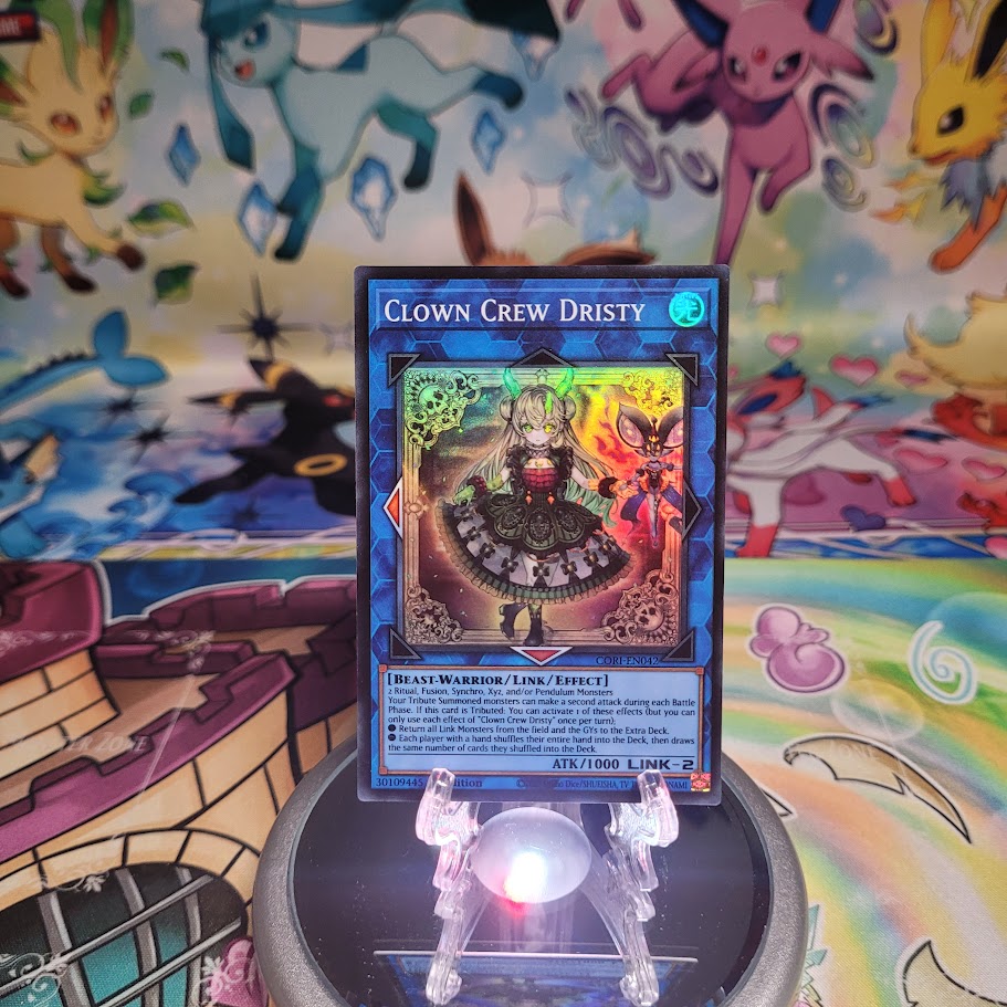 A Super Rare “Clown Crew Dristy” card from the Yugioh Set: Chaos Origins (CORI).