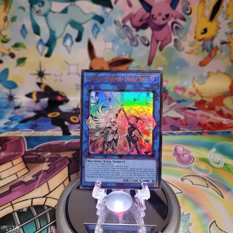 An Ultra Rare "Combined Maneuver - Engage Zero!" card from the Yugioh Legendary Modern Decks (L26D).