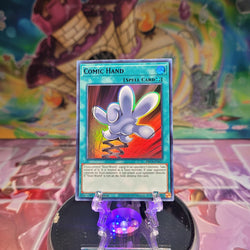An Ultra Rare Purple "Comic Hand" card from the Yugioh Set: Dragons of Legend: The Complete Series (DLCS).