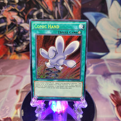 A Secret Rare "Comic Hand" card from the Yugioh Set: Dragons of Legend 2 (DRL2).