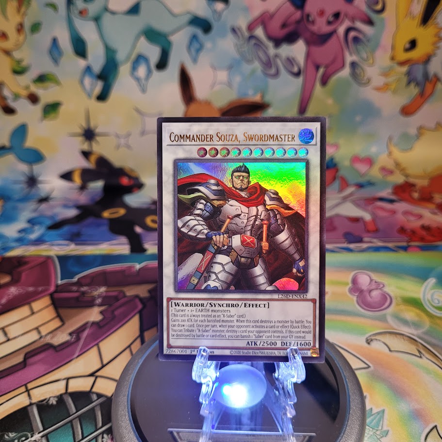 An Ultra Rare "Commander Souza, Swordmaster" card from the Yugioh Legendary Modern Decks (L26D).