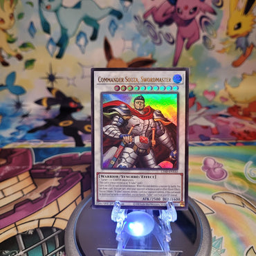 An Ultra Rare "Commander Souza, Swordmaster" card from the Yugioh Legendary Modern Decks (L26D).