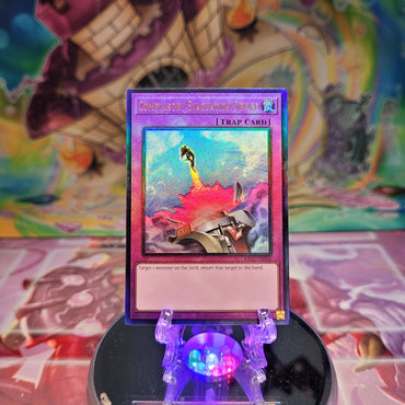 A Prismatic Ultimate Rare "Compulsory Evacuation Device" card from the Yugioh Set: Rarity Collection 1 (RA01).