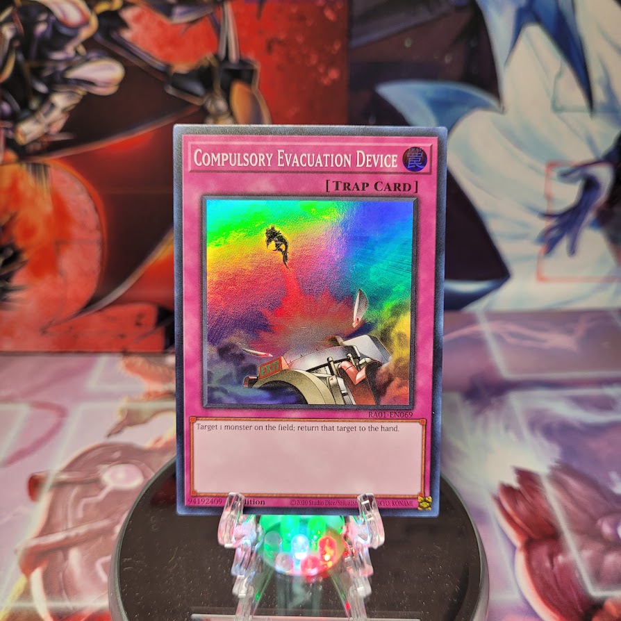 A Super Rare "Compulsory Evacuation Device" card from the Yugioh Set: Rarity Collection 1 (RA01).