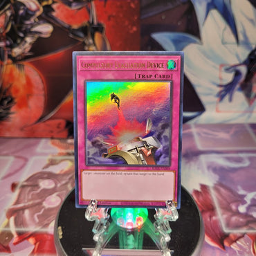 An Ultra Rare "Compulsory Evacuation Device" card from the Yugioh Set: Rarity Collection 1 (RA01).