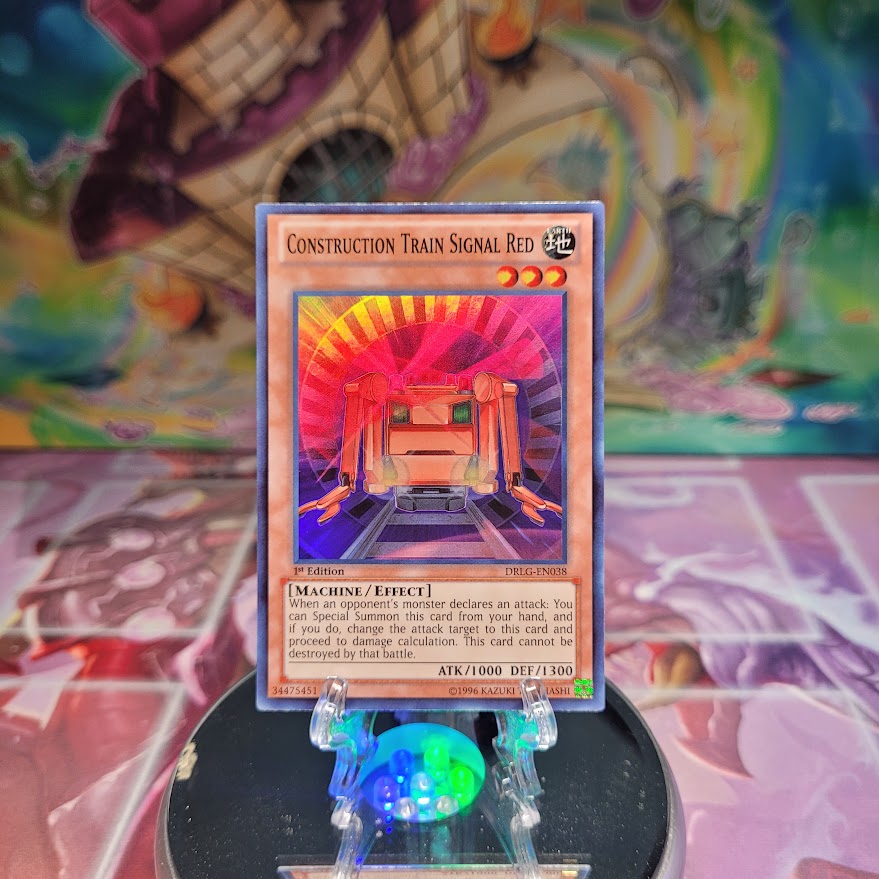 A Super Rare "Construction Train Signal Red" card from the Yugioh Set: Dragons of Legend.