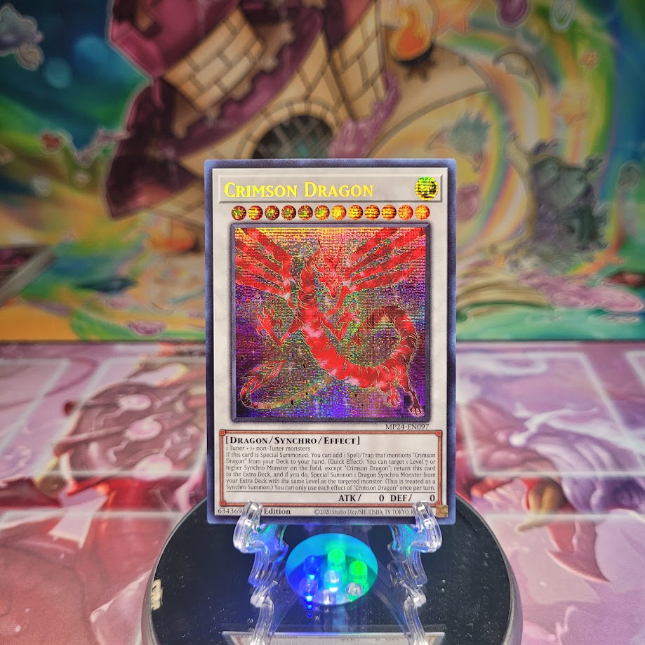 A Prismatic Secret Rare "Crimson Dragon" card from the Yugioh Set: 25th Anniversary Tin: Dueling Mirrors.