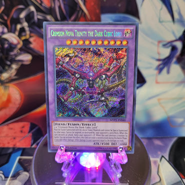 A Secret Rare "Crimson Nova Trinity The Dark Cubic Lord" card from the Yugioh Set: The Dark Side of Dimensions Movie Pack: Secret Edition.
