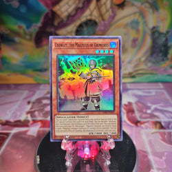 A 1st Edition Super Rare "Crowley the Magistus of Grimoires" card from the Yugioh Set: Genesis Impact.