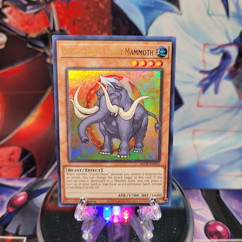 An Ultra Rare "Crystal Beast Amber Mammoth" card from the Yugioh Set: Battles of Legend: Crystal Revenge.