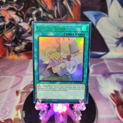 An Ultra Rare Green "Crystal Bond" card from the Yugioh Set: Legendary Duelists: Season 1 (LDS1).