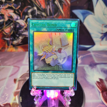 An Ultra Rare Green "Crystal Bond" card from the Yugioh Set: Legendary Duelists: Season 1 (LDS1).
