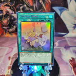 An Ultra Rare Purple "Crystal Bond" card from the Yugioh Set: Legendary Duelists: Season 1 (LDS1).