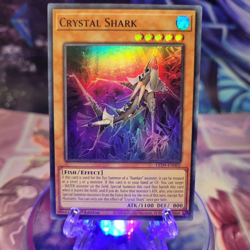  A Super Rare "Crystal Shark" card from the Yugioh Set: Legendary Duelists: Duels From the Deep.