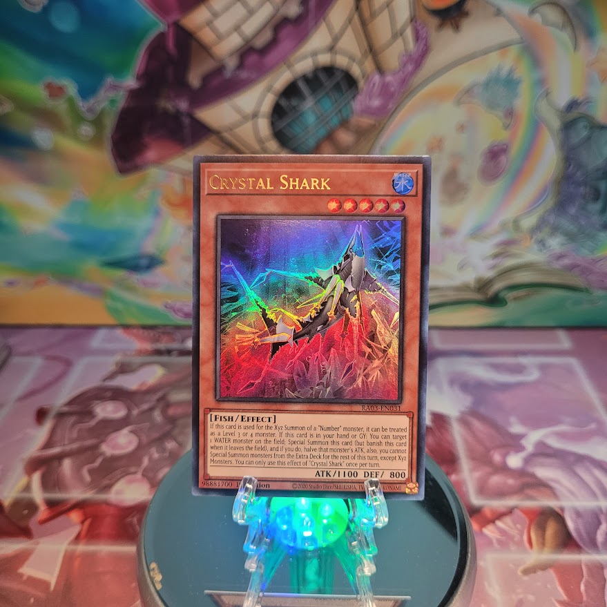 An Ultra Rare "Crystal Shark" card from the Yugioh Set: Quarter Century Bonanza (RA03).