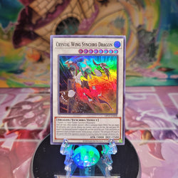 A Super Rare "Crystal Wing Synchro Dragon" card from the Yugioh OTS Tournament Pack 13 set.