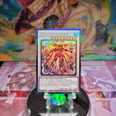 A Prismatic Ultimate Rare "Crystron Phoenix" card from the Yugioh Set: Quarter Century Stampede (RA04).