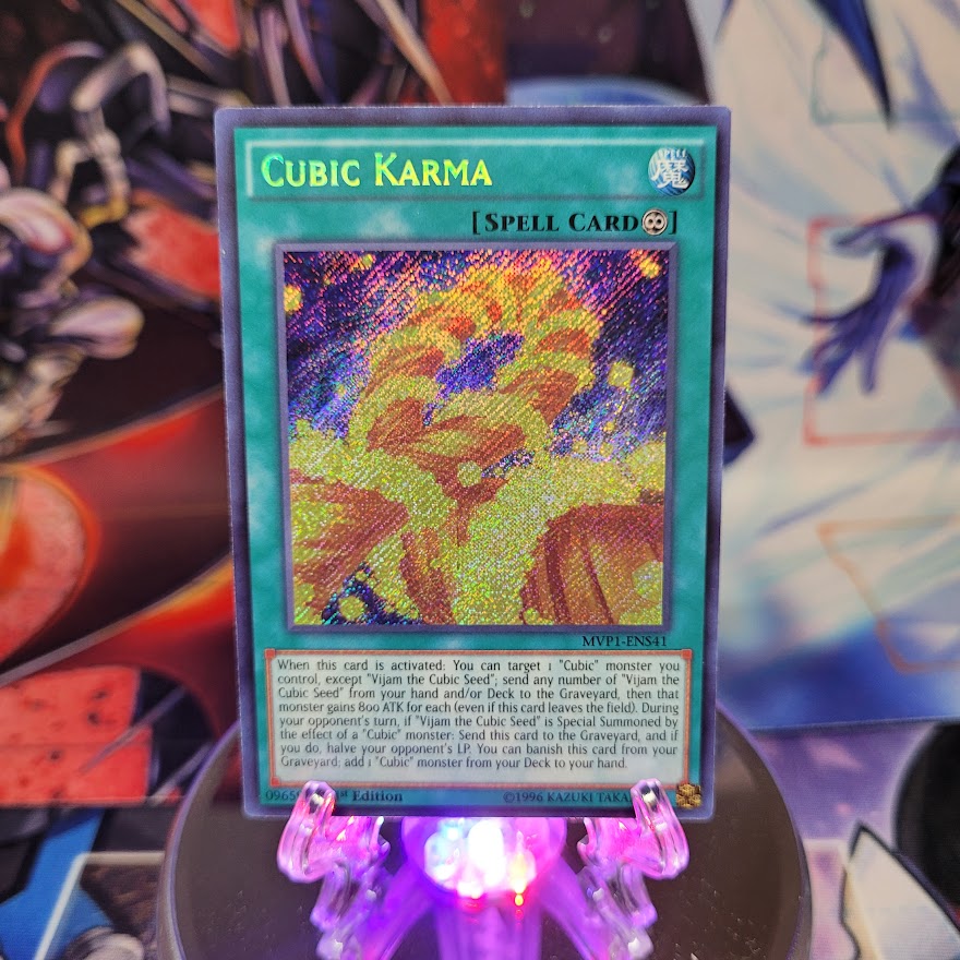 A Secret Rare "Cubic Karma" card from the Yugioh Set: The Dark Side of Dimensions Movie Pack: Secret Edition.