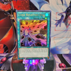 An Ultra Rare "Curse Reflection Doll" card from the Yugioh Set: Battles of Legend: Crystal Revenge.