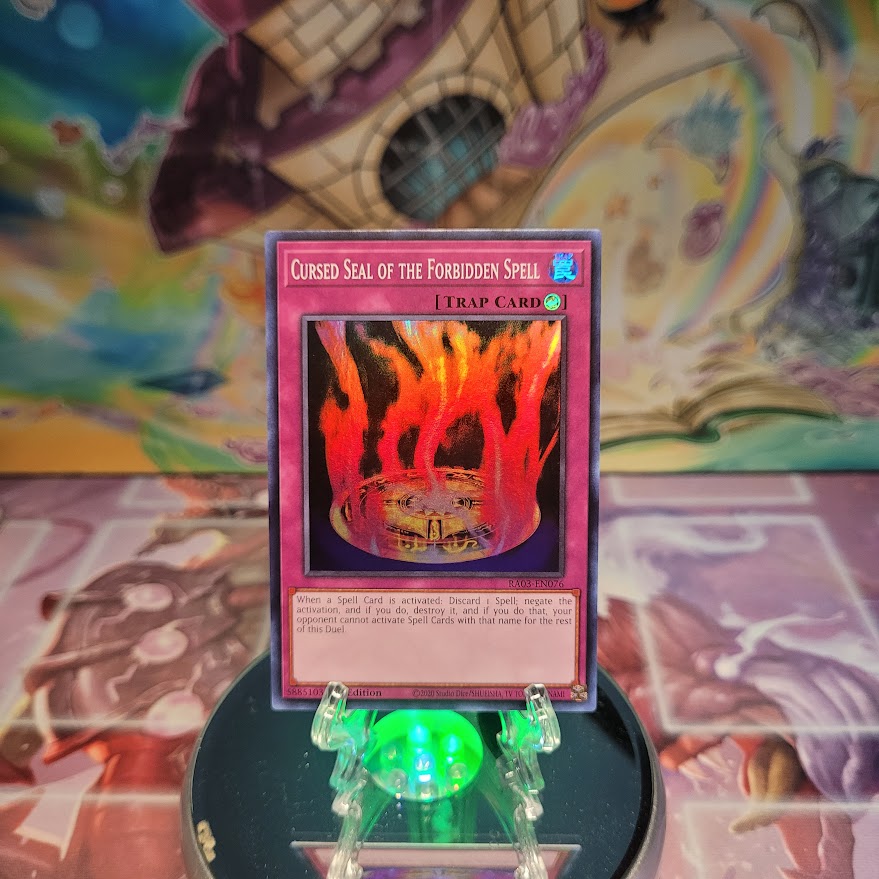 A Super Rare "Cursed Seal of the Forbidden Spell" card from the Yugioh Set: Quarter Century Bonanza (RA03).