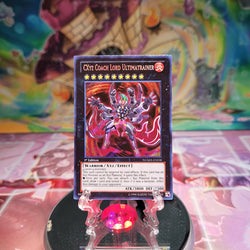 A Secret Rare "Cxyz Coach Lord Ultimatrainer" card from the Yugioh Set: Number Hunters.