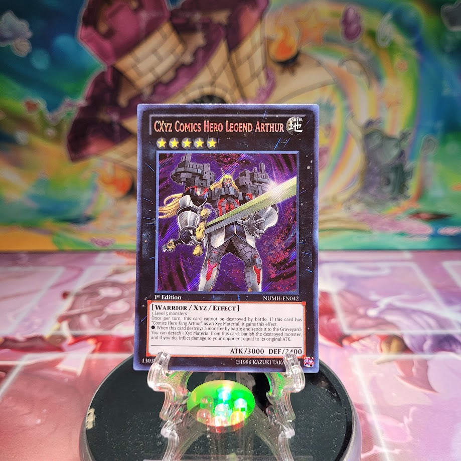 A Secret Rare "Cxyz Comics Hero Legend Arthur" card from the Yugioh Set: Number Hunters.