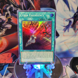 A Super Rare "Cyber Emergency" card from the Yugioh Set: Genesis Impact.