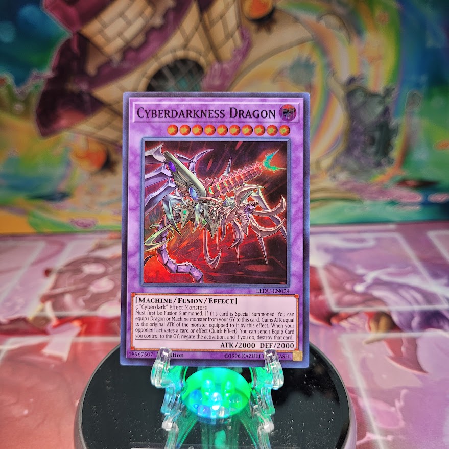 A Super Rare "Cyberdarkness Dragon" card from the Yugioh Set: Legendary Duelists (LEDU).