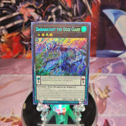 A Secret Rare "Daidaratant the Ooze Giant" card from the Yugioh Set: Battles of Legend: Monstrous Revenge (BLMR).