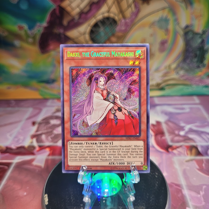 A 1st Edition Secret Rare "Dakki, the Graceful Mayakashi" card from the Yugioh Set: Hidden Summoners.