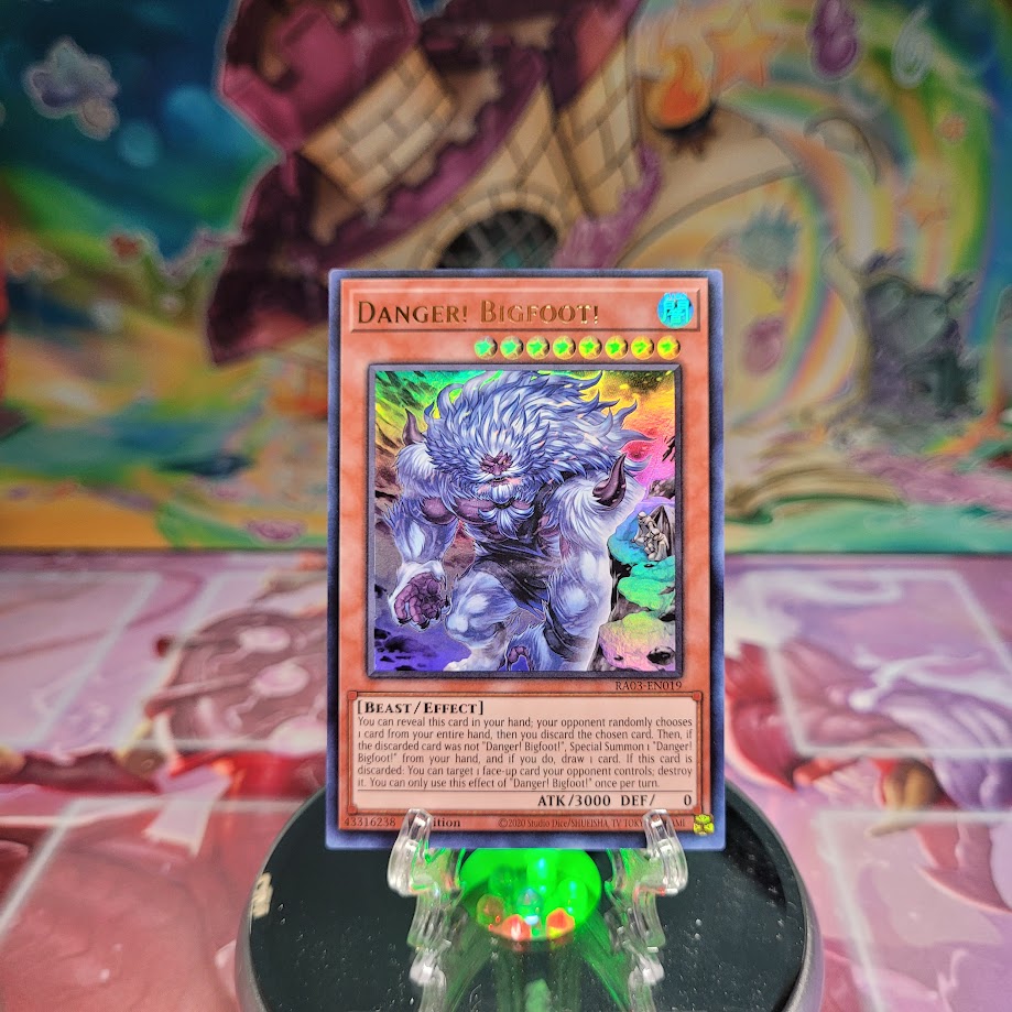An Ultra Rare Alternate Art "Danger! Bigfoot!" card from the Yugioh Set: Quarter Century Bonanza (RA03).
