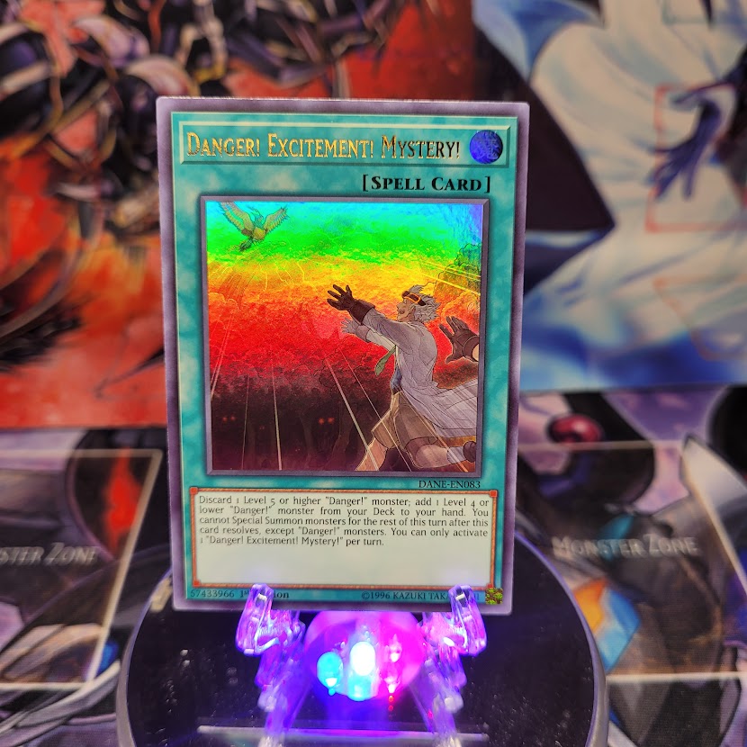 An Ultra Rare "Danger! Excitement! Mystery!" card from the Yugioh Set: Dark Neostorm.