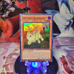 A Super Rare "Danger!? Jackalope?" card from the Yugioh Set: Rarity Collection 1 (RA01).