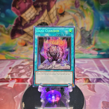 An Prismatic Secret Rare "Dark Corridor" card from the Yugioh Set: 25th Anniversary Tin: Dueling Mirrors.