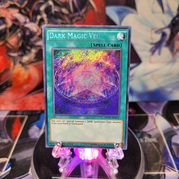 A Secret Rare "Dark Magic Veil" card from the Yugioh Set: The Dark Side of Dimensions: Movie Pack Secret Edition.