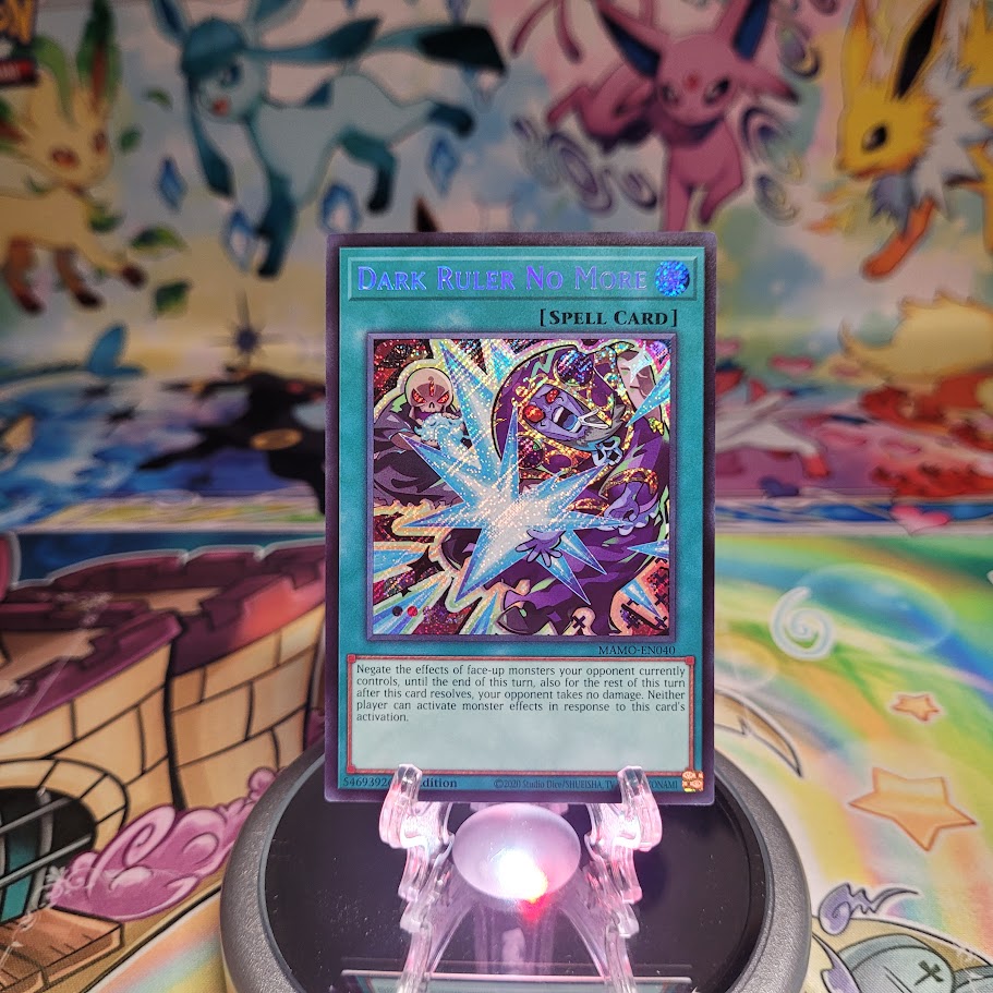 A Secret Rare "Dark Ruler No More" card from the Yugioh Set: Magnificent Monsters (MAMO).