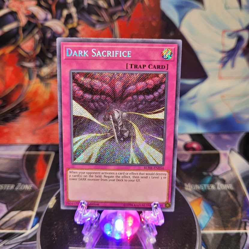 A Secret Rare "Dark Sacrifice" card from the Yugioh Set: Battles of Legend: Hero's Revenge.