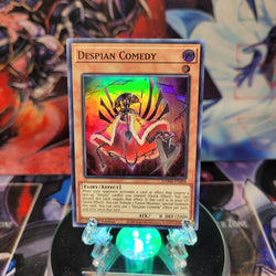 A Super Rare "Despian Comedy" card from the Yugioh Set: Dawn of Majesty.