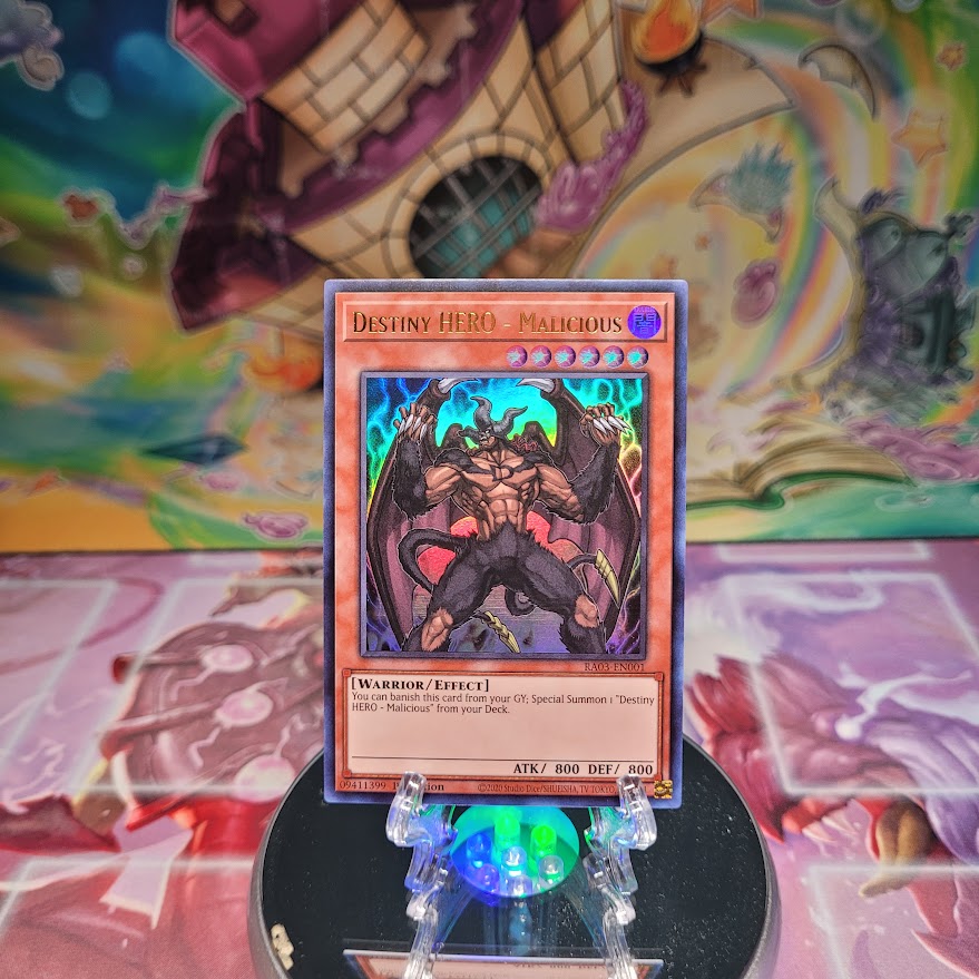 An Ultra Rare "Destiny Hero - Malicious" card from the Yugioh Set: Quarter Century Bonanza (RA03).