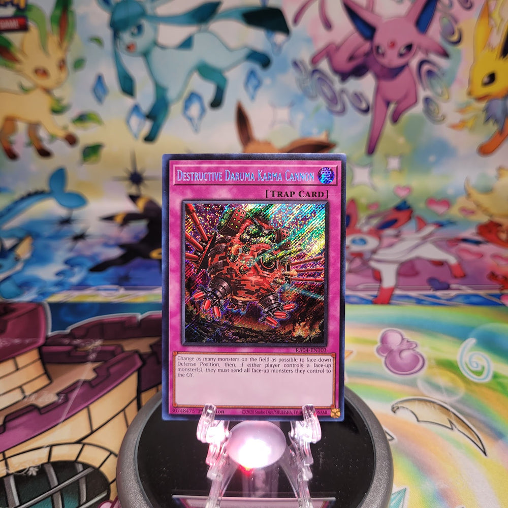 A Secret Rare "Destructive Daruma Karma Cannon" card from the Yugioh Set: Quarter Century Stampede (RA04)