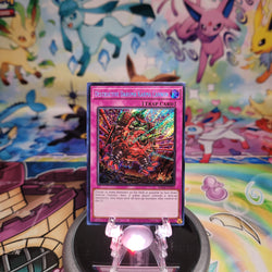 A Secret Rare "Destructive Daruma Karma Cannon" card from the Yugioh Set: Quarter Century Stampede (RA04)